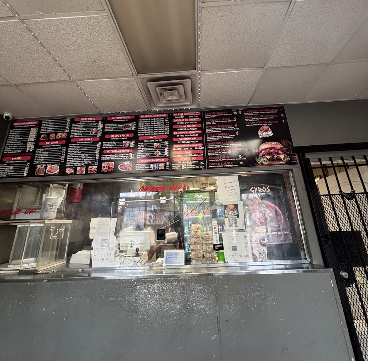 The counter and menu board inside New Best Sub